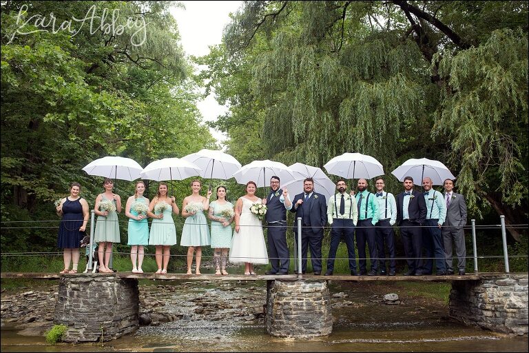 Rustic Pastel Rainy Summer Wedding First Look at Robert Treman State Park in Ithaca, NY by Kara Abbey Photography in Irwin, PA