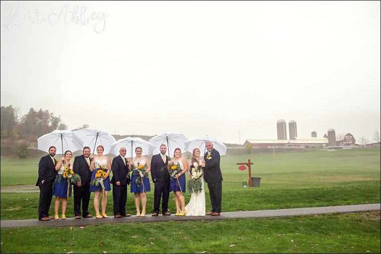 Bridal Party Portrait in the Rain with Umbrellas by Irwin, PA Wedding Photographer