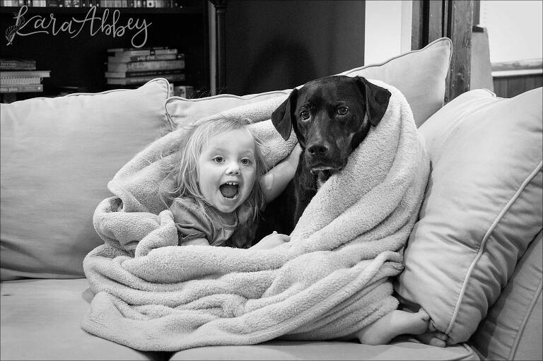 Black Lab & Toddler Snuggling on the Couch in Irwin, PA