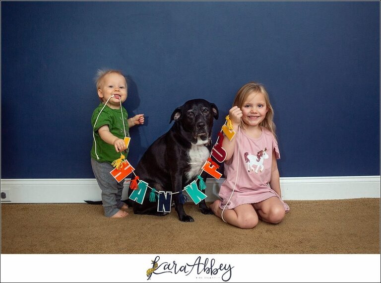 A Black Lab & 2 Kids Holding a Thankful Sign - Abby's Saturday Series - in Irwin, PA