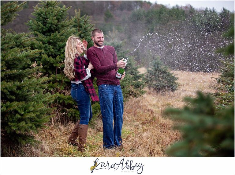 Cold Rainy Engagement Session on Family Christmas Tree Farm in Pennsylvania - Champagne Pop - by Kara Abbey Photography