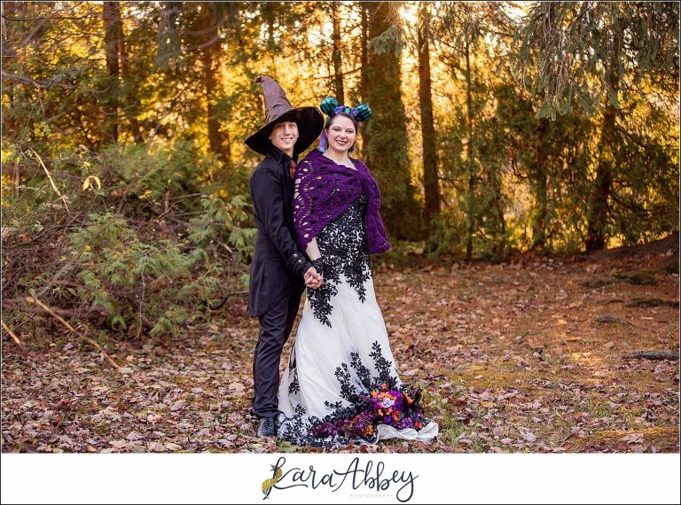Black and Purple Disney Halloween Themed Fall Wedding at Green Gables in Jennerstown PA - Bride & Groom Portraits During Golden Hour wearing Mickey Ears & the Sorting Hat