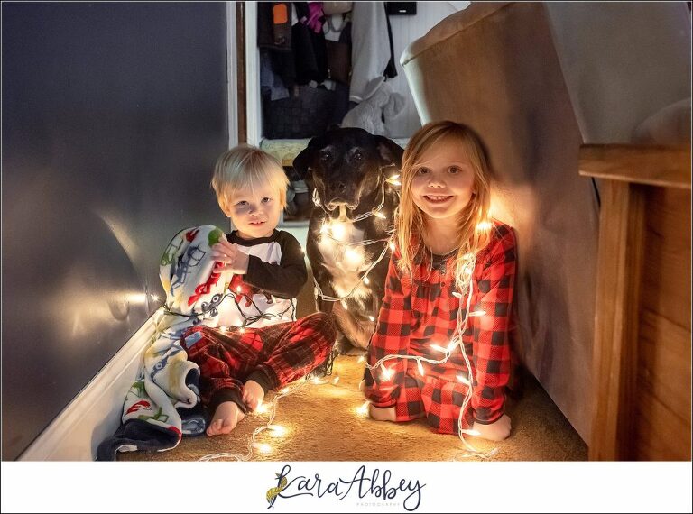 Abbys Saturday Kids & Dog Wrapped Up In Christmas Lights
