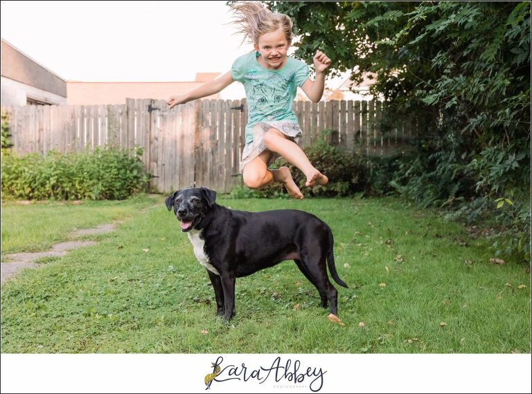 Abbys Saturday Little Girl Jumping Over Black Lab in Irwin PA