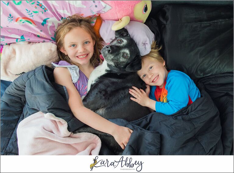 Abbys Saturday Kids and Black Lab Snuggled up in Bed in Irwin PA