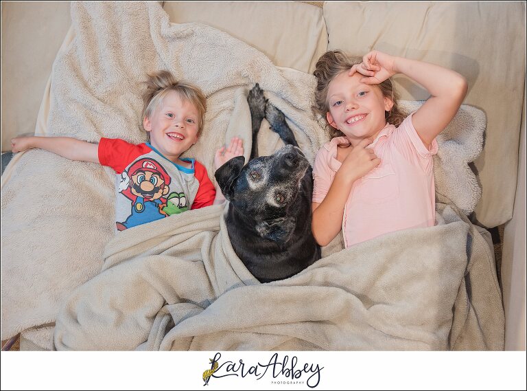 Abbys Saturday Black Lab and Kids Snuggled Up in Living Room in Irwin PA